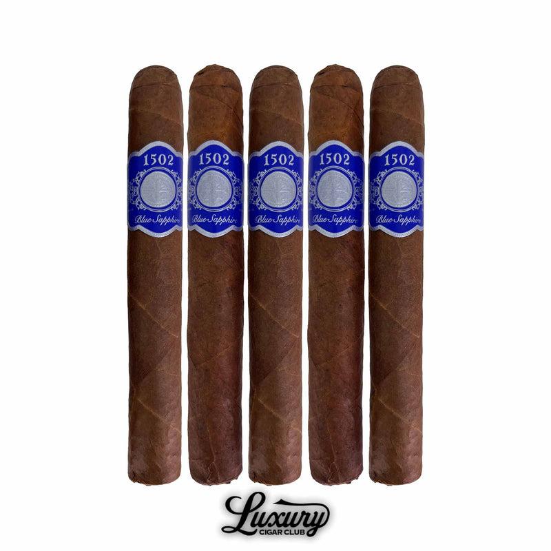 Five-pack of 1502 Blue Sapphire Toro Gordo cigars from Luxury Cigar Club with rich brown wrappers and elegant blue and silver cigar bands, displayed on a white background.