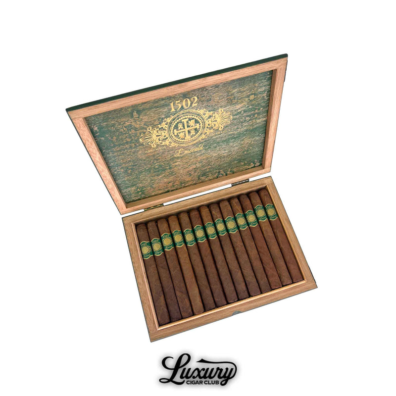 Open cedar box of 1502 Emerald Corona cigars with green and gold bands, available at Luxury Cigar Club.