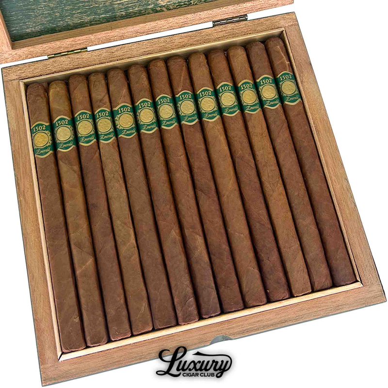 Close-up view of 1502 Emerald Lancero cigars inside box, showing smooth brown wrappers and detailed green bands, Luxury Cigar Club.