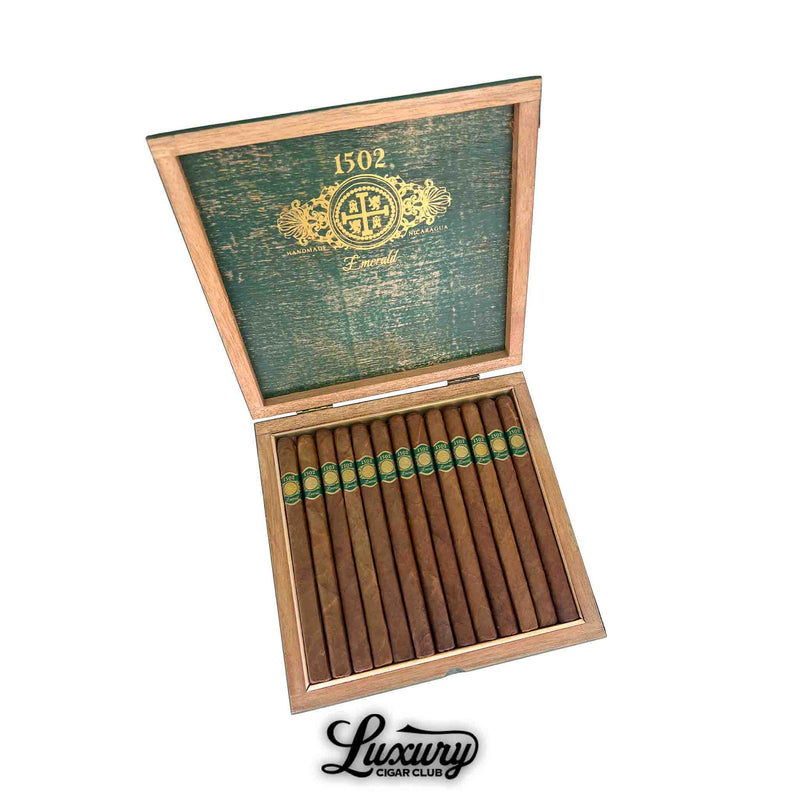 Open cedar box of 1502 Emerald Lancero cigars with green and gold bands, available at Luxury Cigar Club.