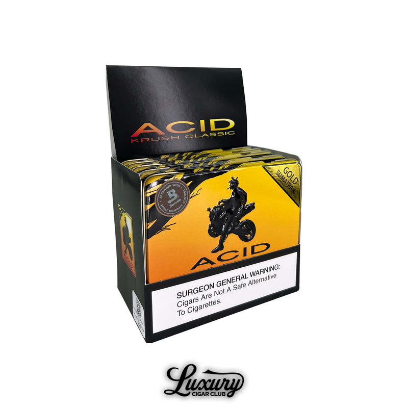 ACID Krush Gold Sumatran cigars display box. Open retail display box of ACID Krush Classic Gold Sumatran cigars with vibrant gold and black packaging and motorcycle silhouette artwork.