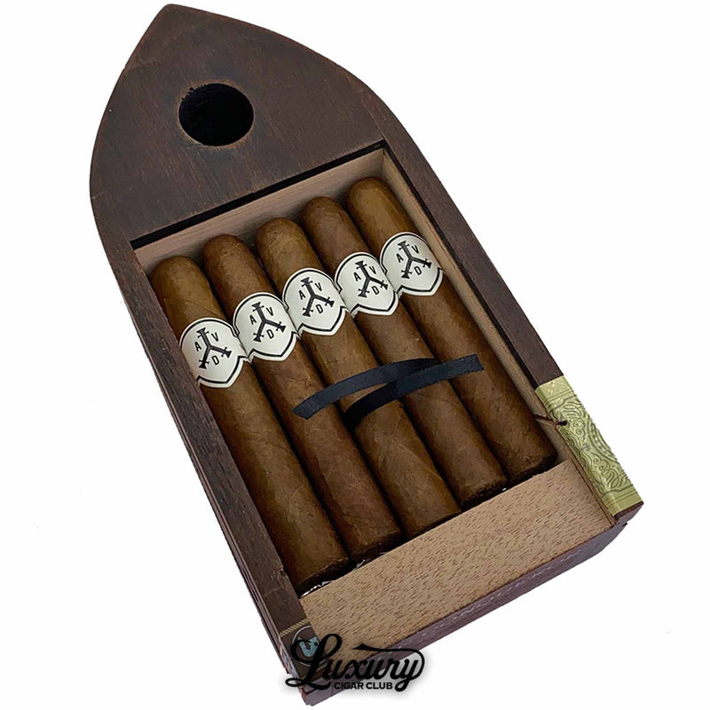 Close-up of ADVentura The Conqueror Comandante cigars inside signature boat-shaped wooden box, Luxury Cigar Club exclusive boutique cigars.