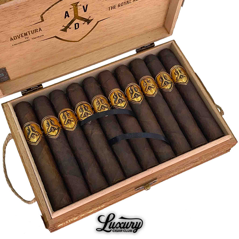 Close-up view of ADVentura The Royal Return Kings Gold Robusto cigars in an open wooden box from Luxury Cigar Club.