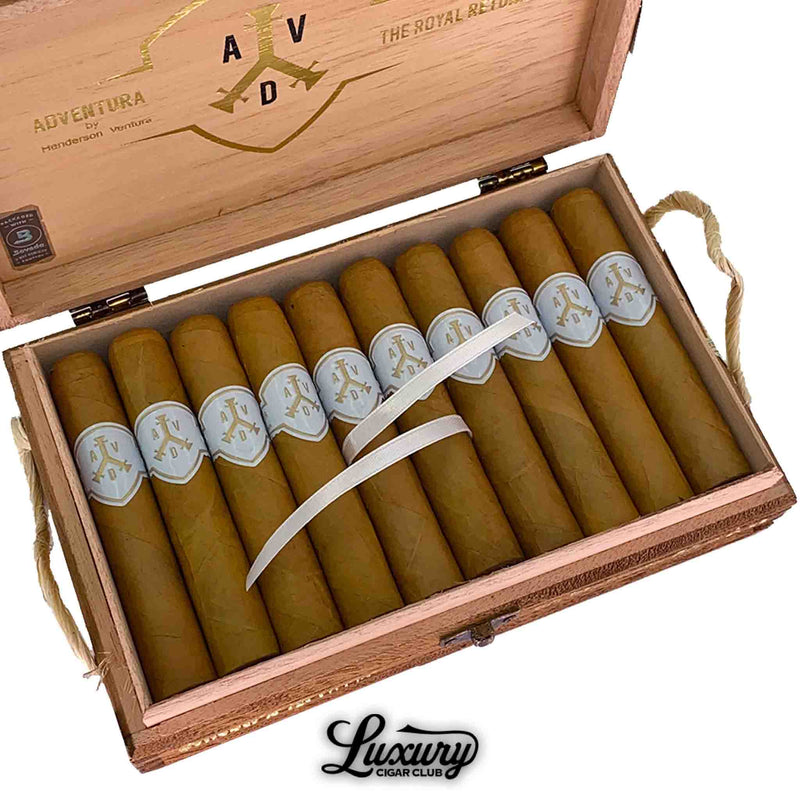 Close-up of ADVentura The Royal Return Queen’s Pearls Robusto cigars in open wooden box, premium Connecticut cigars from Luxury Cigar Club.
