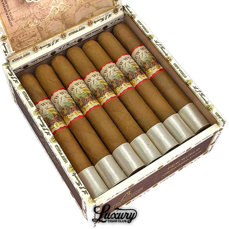 Close-up of AJ Fernandez New World Connecticut Corona Gordo cigars inside an elegant cream and gold box, highlighting the detailed bands, presented by Luxury Cigar Club.