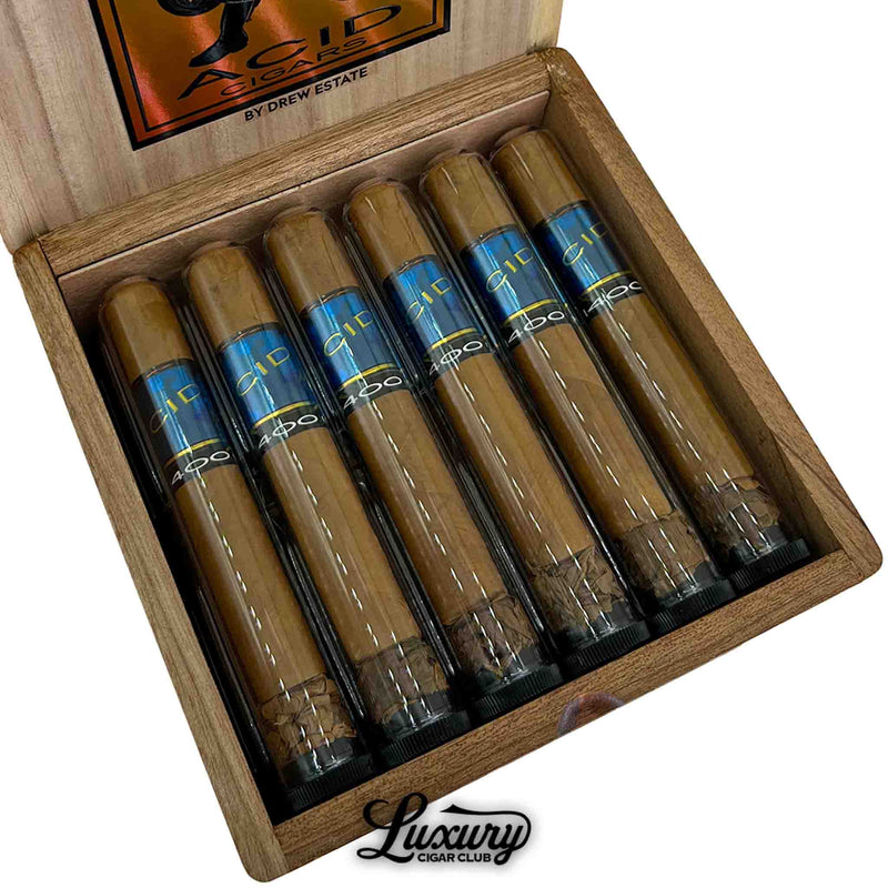 Close-up of open box of Acid 1400cc Robusto Tubo cigars, each in a sleek tube with blue and gold Acid branding, arranged neatly in a natural wood box with Luxury Cigar Club logo below.