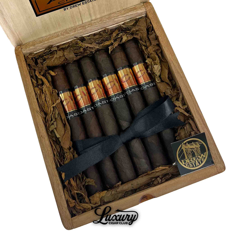 Close-up of Acid Subculture Toast cigars in open wooden box with tobacco leaf lining and holographic orange-brown bands, Luxury Cigar Club logo