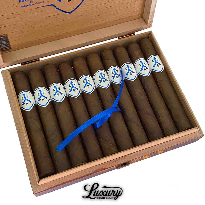 Close-up of ADVentura The Navigator Cabral cigars in open box with blue ribbon, premium Nicaraguan cigars from Luxury Cigar Club.
