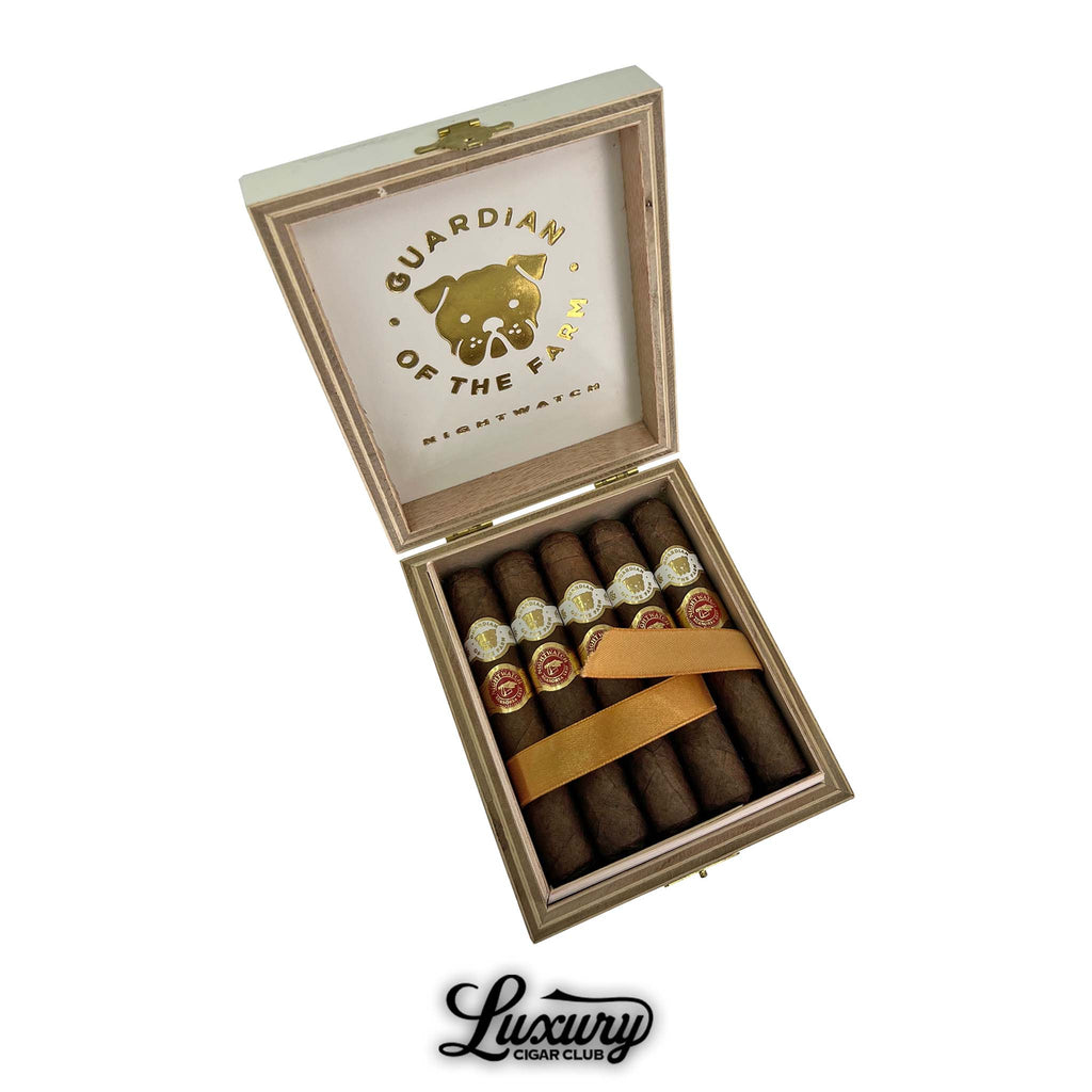 Open box of Aganorsa Leaf Guardian of the Farm Night Watch Rambo cigars with gold dog logo, premium handmade cigars available online at Luxury Cigar Club.