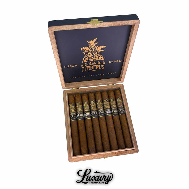 Aganorsa Leaf Guardian Of The Farm Cerberus Toro cigars displayed in an open wooden box with black and gold branding by Luxury Cigar Club.