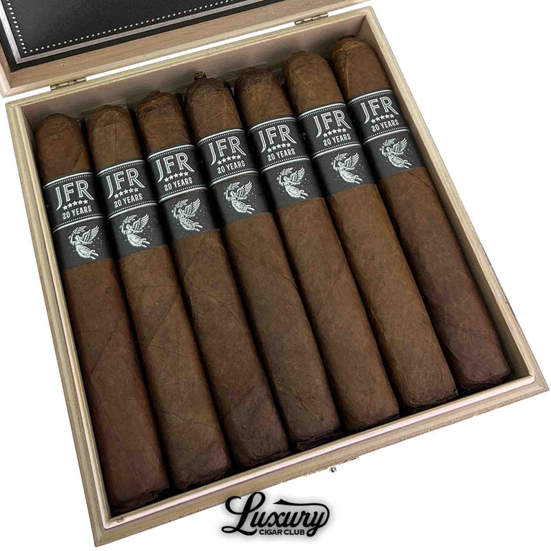 Close-up of Aganorsa Leaf JFR 20th Anniversary 770 cigars in box with black and silver bands from Luxury Cigar Club.