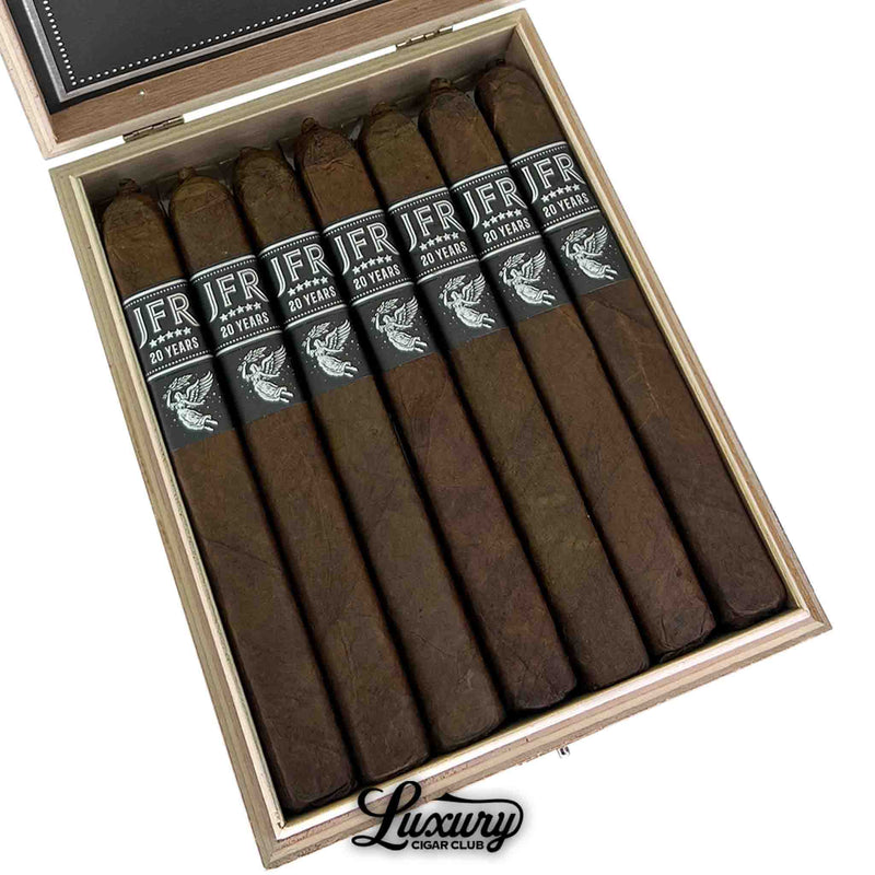 Close-up of Aganorsa Leaf JFR 20th Anniversary Super Toro cigars with black and silver bands in an open box from Luxury Cigar Club.
