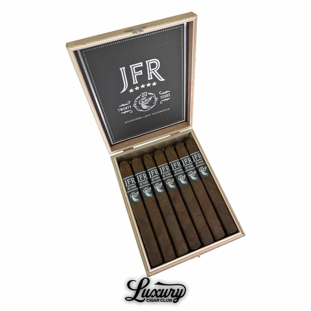 Aganorsa Leaf JFR 20th Anniversary Super Toro cigars displayed in an open box with elegant black and silver bands, available at Luxury Cigar Club.