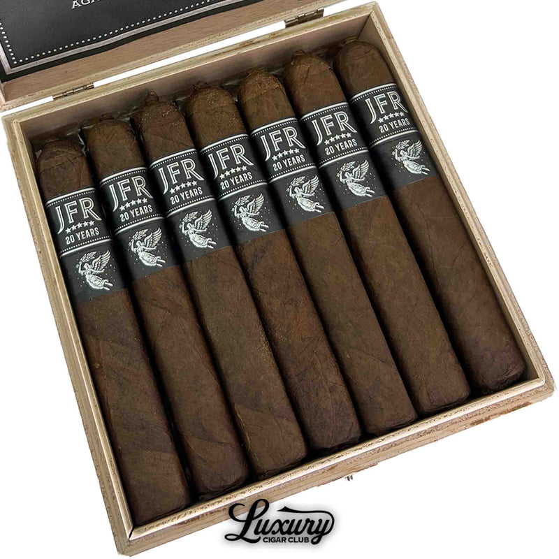 Close-up of Aganorsa Leaf JFR 20th Anniversary Titan cigars in box with dark brown wrappers and black silver bands, Luxury Cigar Club.