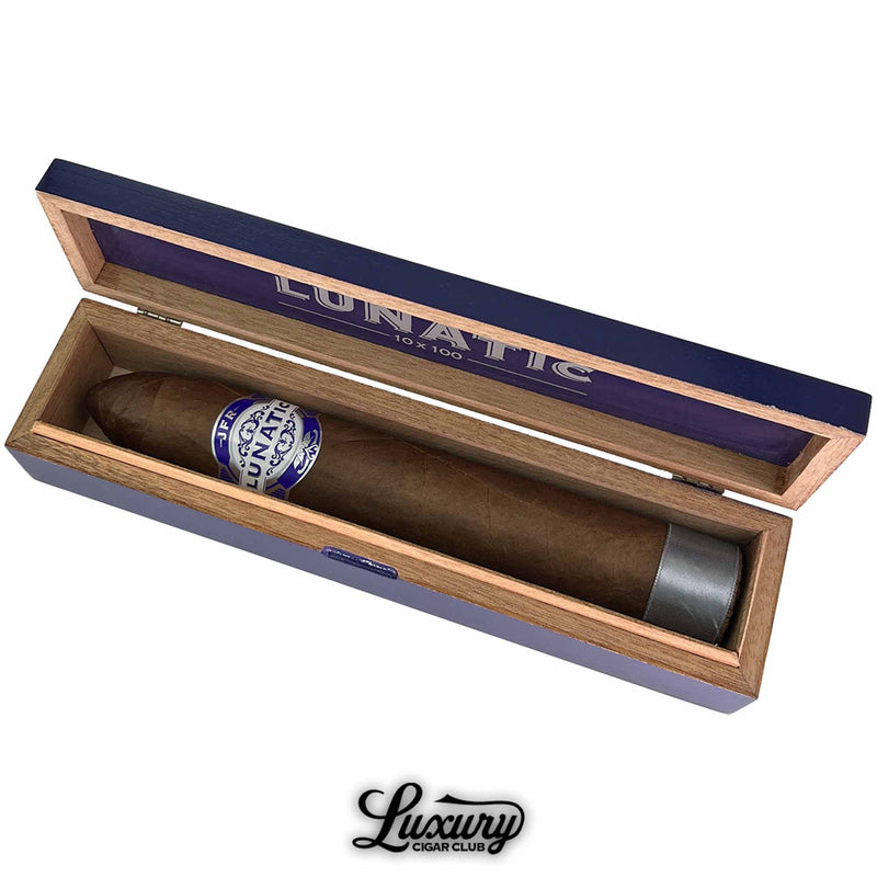 Close-up of Aganorsa Leaf JFR Lunatic Maduro 10x100 cigar inside branded single box, highlighting massive ring gauge and premium band, available at Luxury Cigar Club.