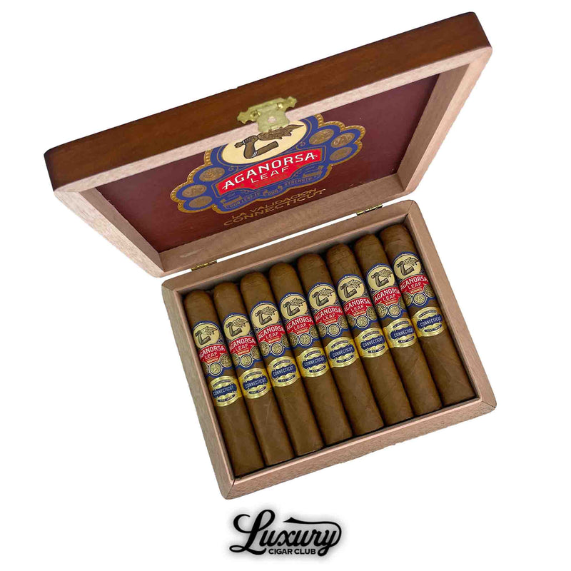  Open box of Aganorsa Leaf La Validación Connecticut Gran Robusto cigars with golden Connecticut wrappers, displayed at Luxury Cigar Club.