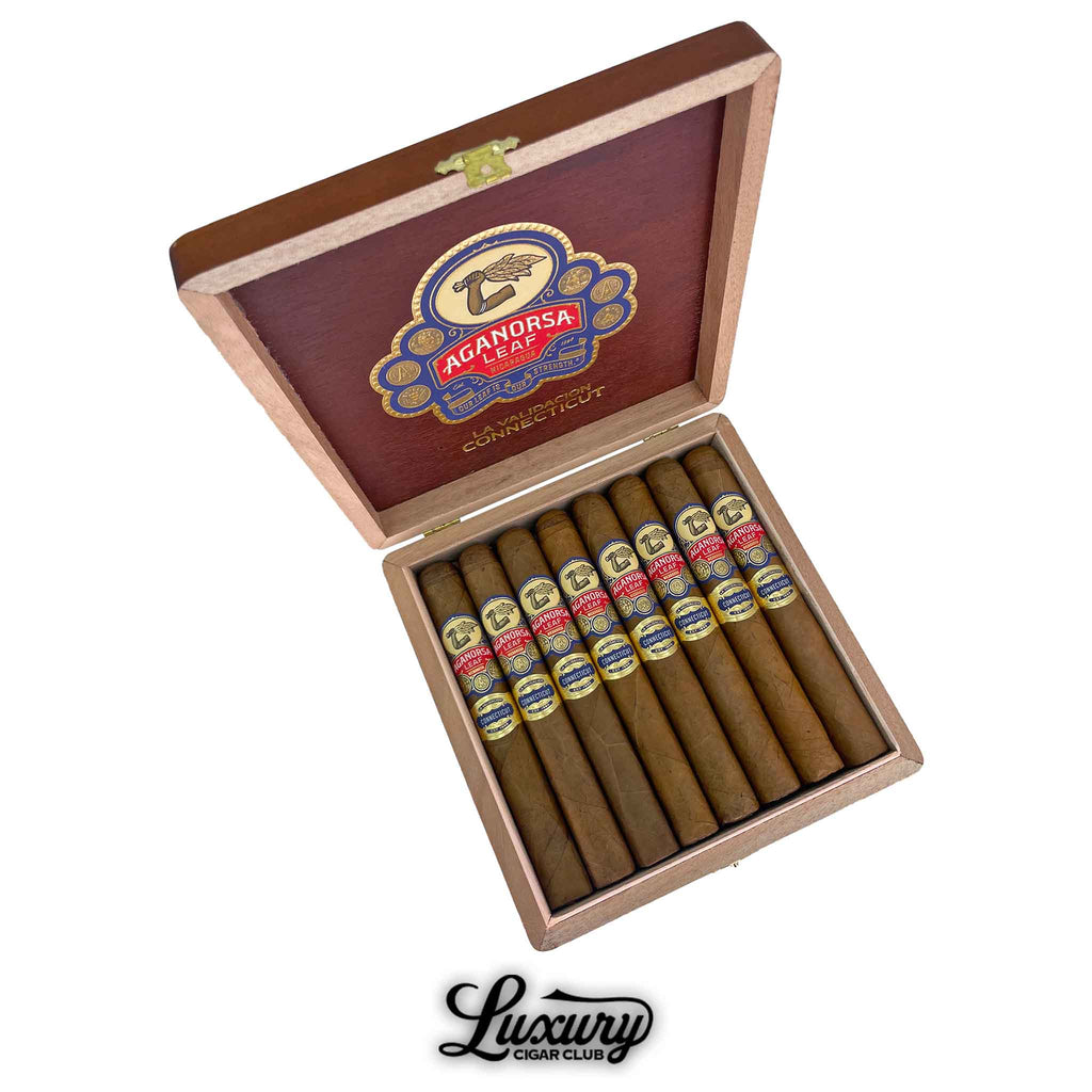 Open box of Aganorsa Leaf La Validación Connecticut Toro cigars with smooth light brown wrappers displayed at Luxury Cigar Club.