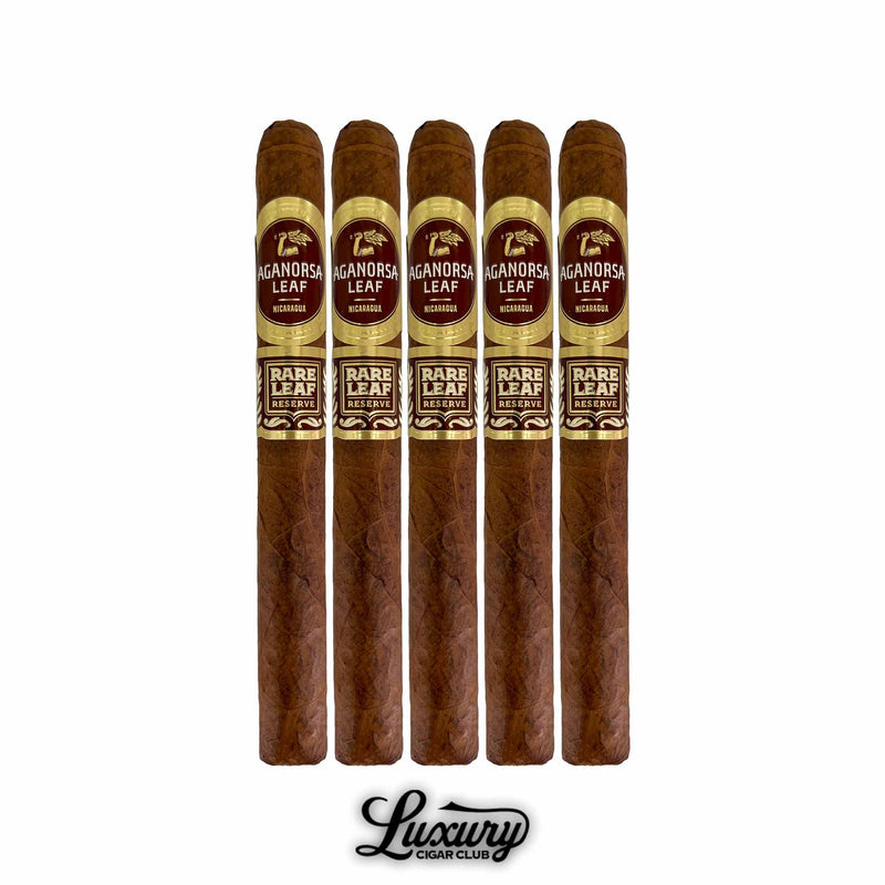 Five Aganorsa Leaf Rare Leaf Reserve Corojo Lonsdale cigars displayed upright, showing uniform brown wrappers and gold-maroon bands. Premium Nicaraguan cigars presented by Luxury Cigar Club.