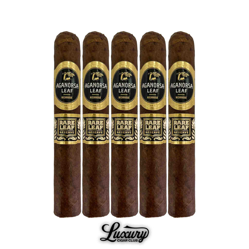Five Aganorsa Leaf Rare Leaf Reserve Maduro Robusto cigars lined up side by side, showcasing the dark Maduro leaf and elegant black-and-gold labeling with Nicaraguan branding. Luxury Cigar Club.