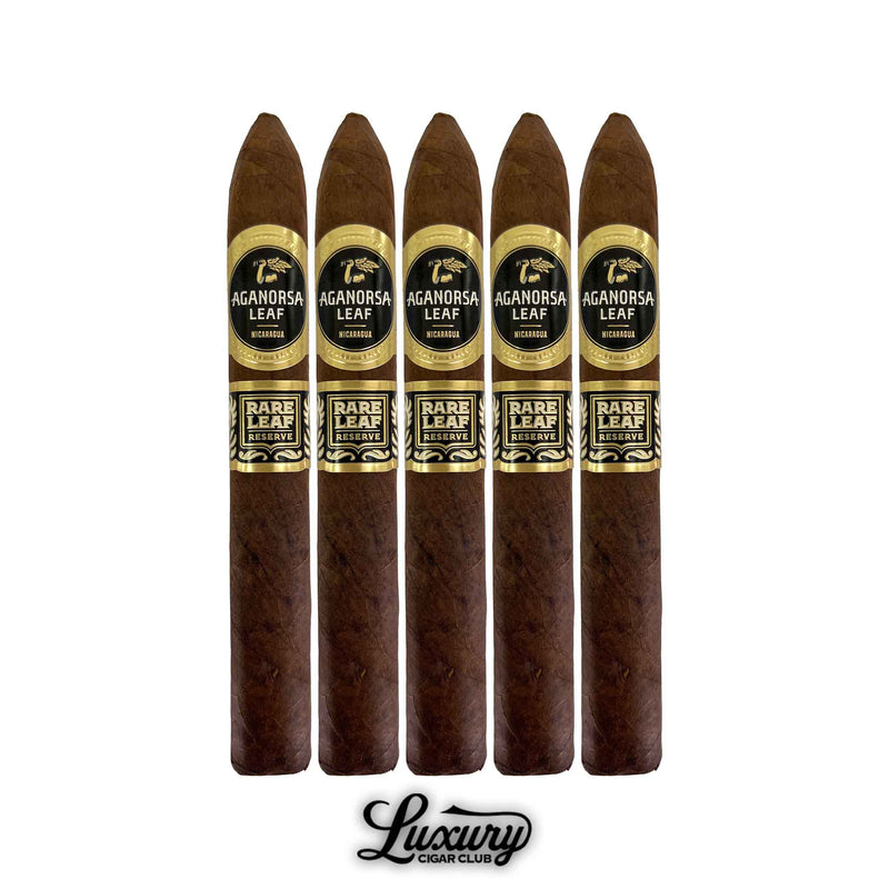 Five Aganorsa Leaf Rare Leaf Reserve Maduro Torpedo cigars displayed upright, featuring pointed caps, dark brown wrappers, and black-and-gold bands with the Aganorsa Leaf insignia. Luxury Cigar Club presentation.