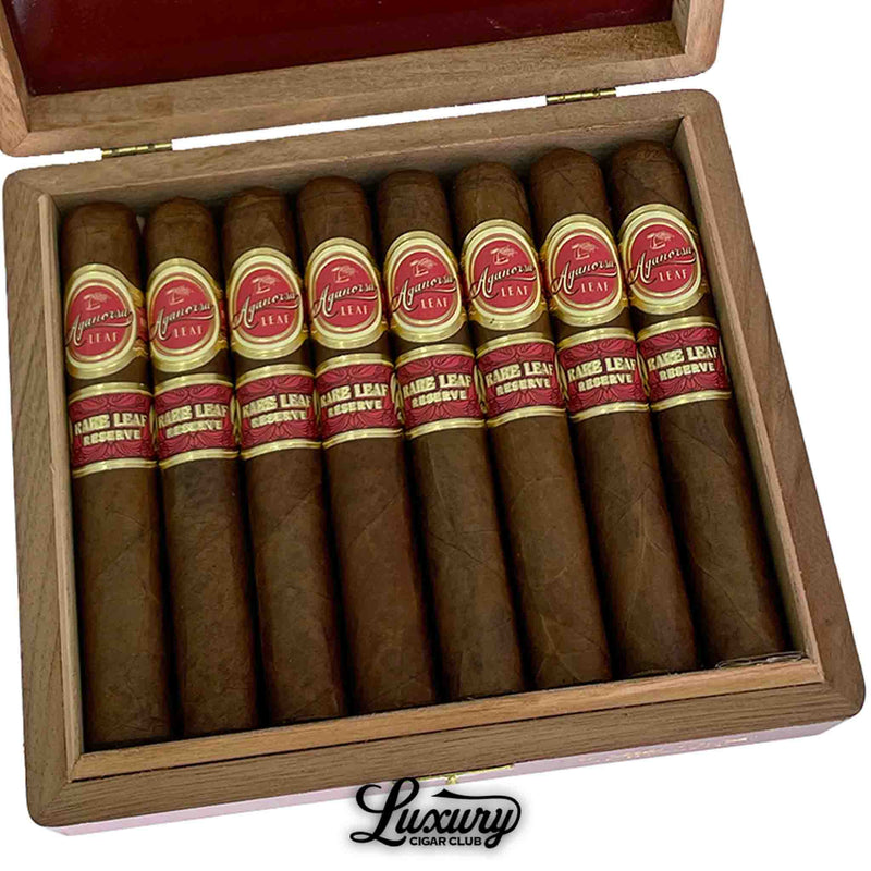 Close-up of Aganorsa Leaf Rare Leaf Reserve Robusto cigars neatly arranged in a wooden box from Luxury Cigar Club.