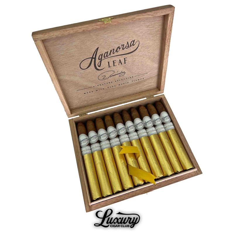Open box of Aganorsa Leaf Signature Selection Belicoso cigars wrapped in gold foil with white bands, premium Nicaraguan cigars available at Luxury Cigar Club.