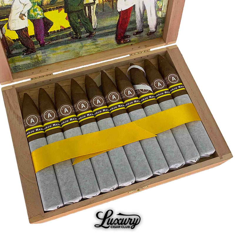 Close-up view of Aladino Corojo Reserva Figurado cigars wrapped with tissue paper and yellow ribbon, premium cigars for sale online.