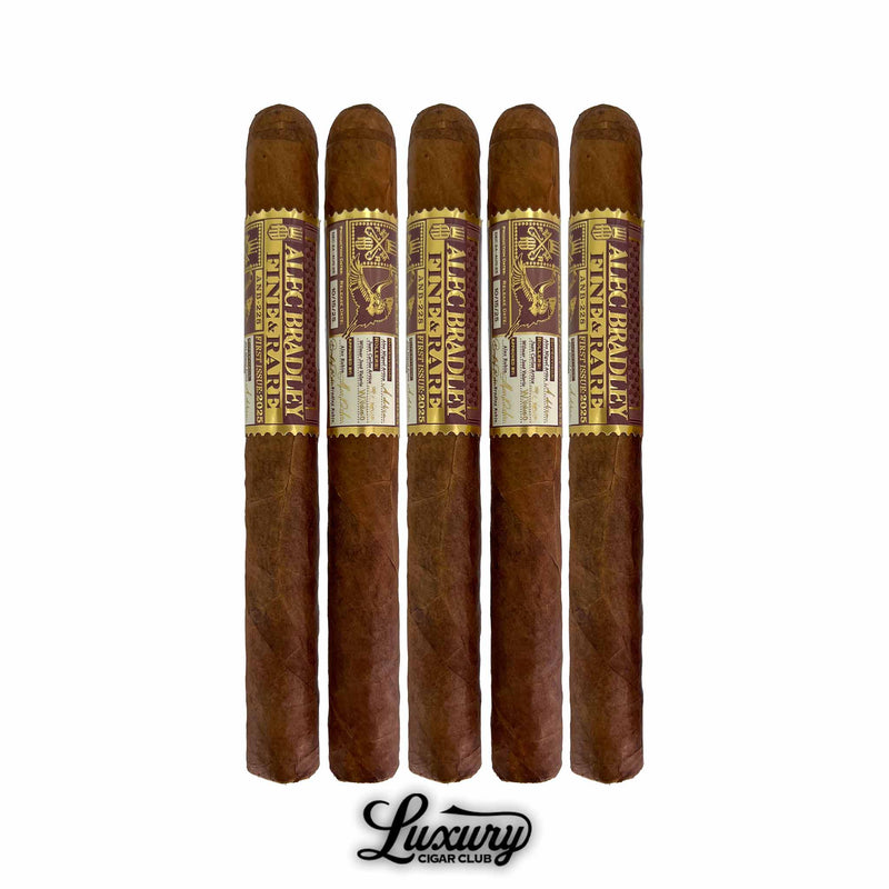 Five Alec Bradley Fine & Rare ANB-228 2025 Churchill cigars standing side-by-side with Luxury Cigar Club branding below, showing the ornate gold and brown Fine & Rare band on each long churchill cigar.