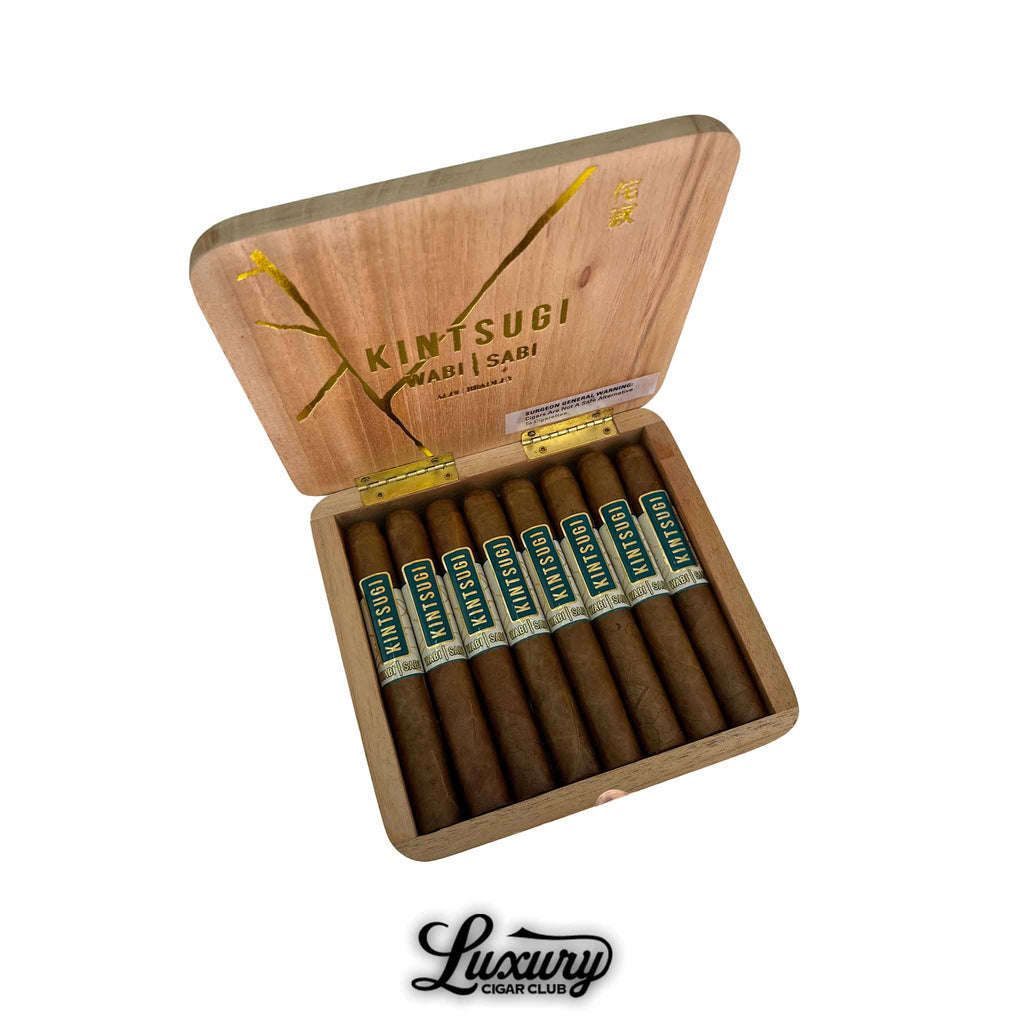 Open wooden box of Alec Bradley Kintsugi Wabi Sabi Limited Edition Toro cigars with golden interior design, displayed with the Luxury Cigar Club logo.