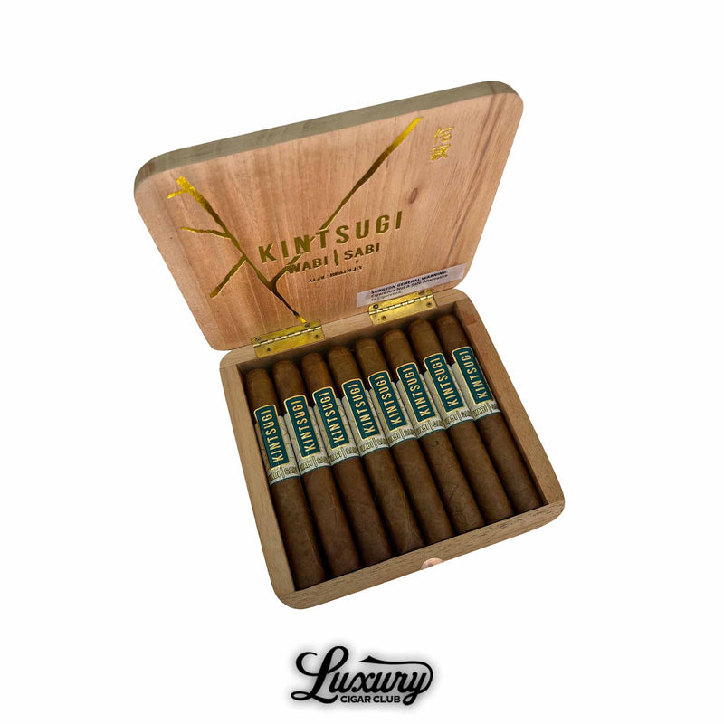 Open wooden box of Alec Bradley Kintsugi Wabi Sabi Limited Edition Toro cigars with golden interior design, displayed with the Luxury Cigar Club logo.