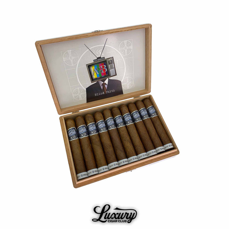 Open box of Alec & Bradley Blind Faith Robusto cigars featuring a modern TV head artwork on the lid, available at Luxury Cigar Club.