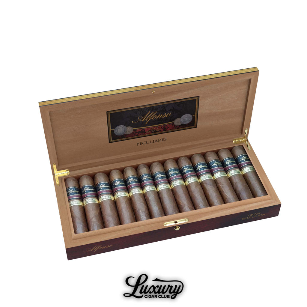Alfonso Gran Selección Peculiares cigars displayed in a luxurious open wooden box, featuring dark navy and gold cigar bands with elegant branding from Luxury Cigar Club.