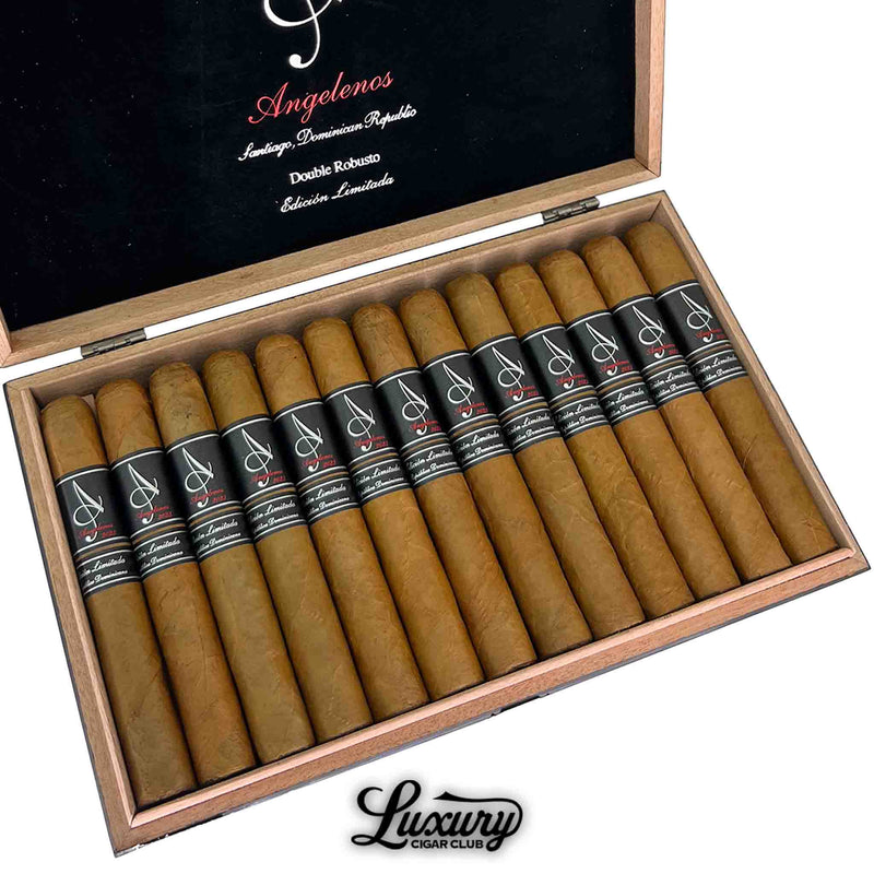 Close-up view of Angelenos Double Robusto Edición Limitada cigars in a wooden box, featuring black and red cigar bands from Luxury Cigar Club.