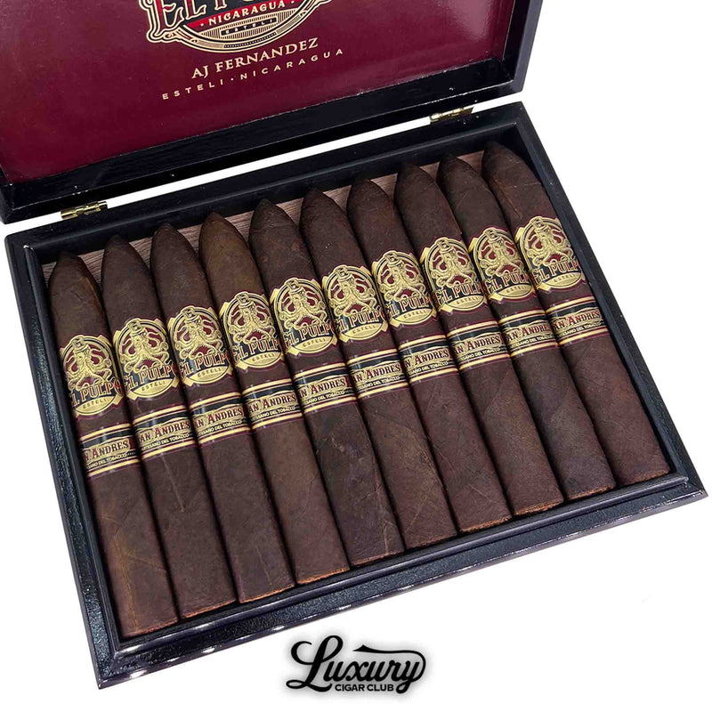 Close-up of a box of Artesano Del Tobacco El Pulpo Belicoso Grande cigars. The cigars feature a dark San Andrés wrapper and pointed belicoso caps, with ornate red and gold bands labeled "El Pulpo" and "San Andrés." The lid displays AJ Fernandez branding. Luxury Cigar Club logo is visible at the bottom.