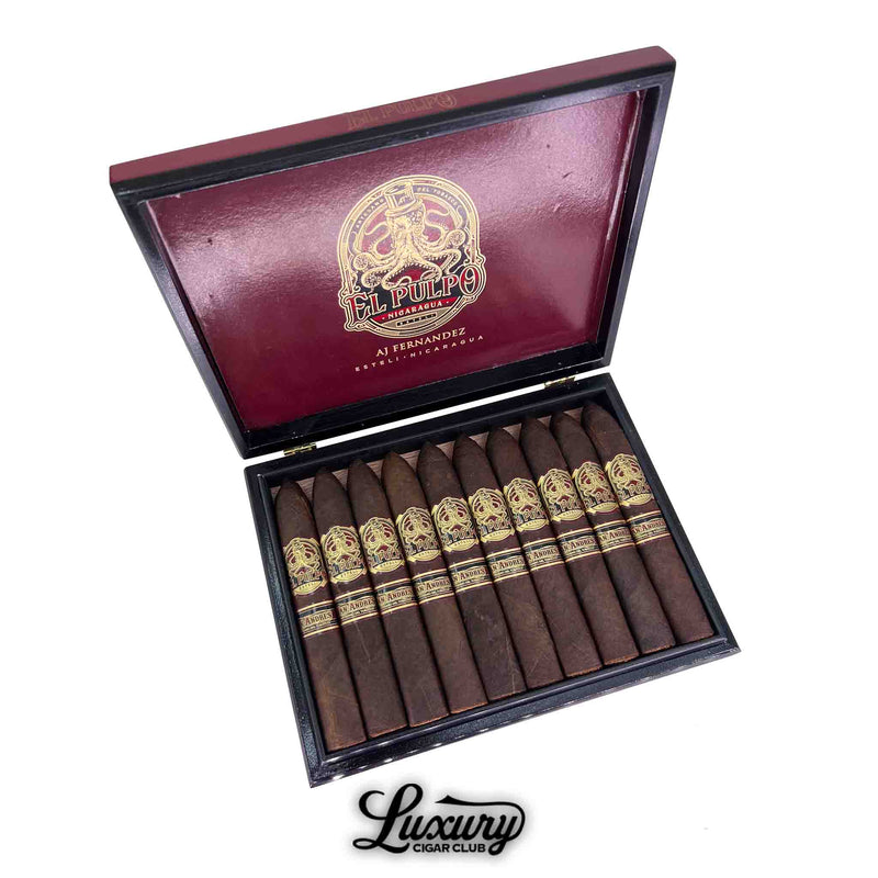 Open box of Artesano Del Tobacco El Pulpo Belicoso Grande cigars, showcasing 10 dark San Andrés-wrapped cigars with tapered heads. Each cigar features a bold red and gold "El Pulpo" band. The interior lid displays a gold octopus logo with "AJ Fernandez" and "Estelí, Nicaragua." Luxury Cigar Club logo appears below the box.