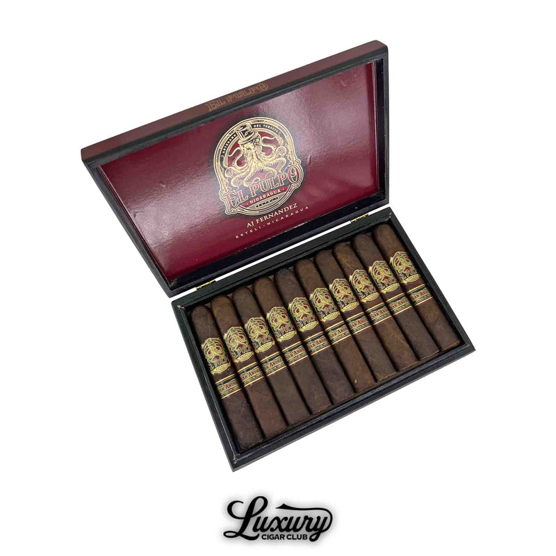 Open box of Artesano Del Tobacco El Pulpo Robusto Grande cigars, featuring 10 dark-wrapped cigars with gold and red octopus-themed bands labeled "El Pulpo" and "San Andres." The interior lid is deep red with a gold El Pulpo logo and AJ Fernandez branding. Luxury Cigar Club logo appears at the bottom.