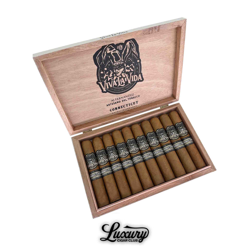 Box of Artesano Del Tabacco Viva La Vida Connecticut Robusto cigars opened to display 10 neatly arranged cigars with light brown Connecticut wrappers and ornate black-and-silver bands. The inside lid features the Viva La Vida logo and branding, with the Luxury Cigar Club logo at the bottom.