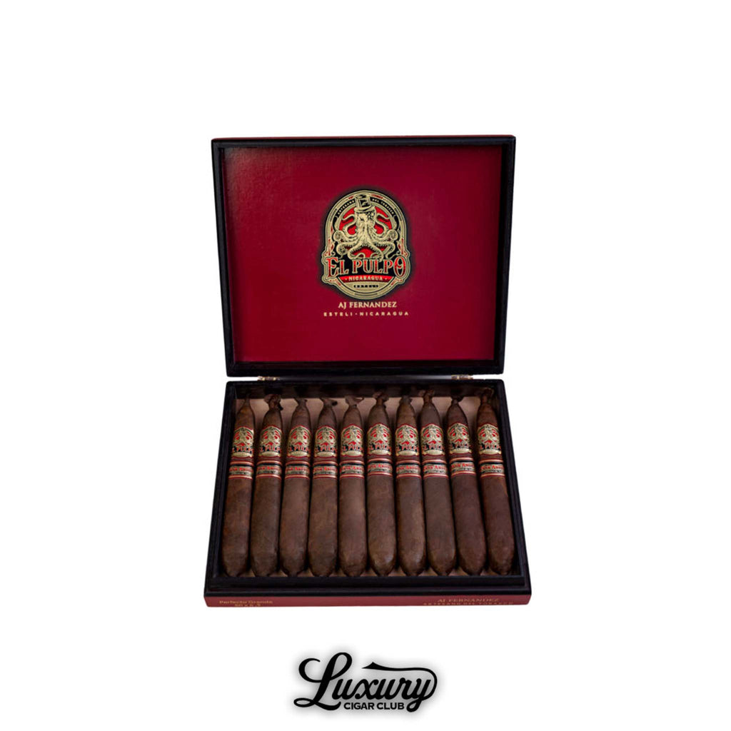 Open box of Artesano Del Tobacco El Pulpo The Squid Perfecto Box Pressed cigars by AJ Fernandez, featuring ornate red and gold bands inside a red and black box, available at Luxury Cigar Club.