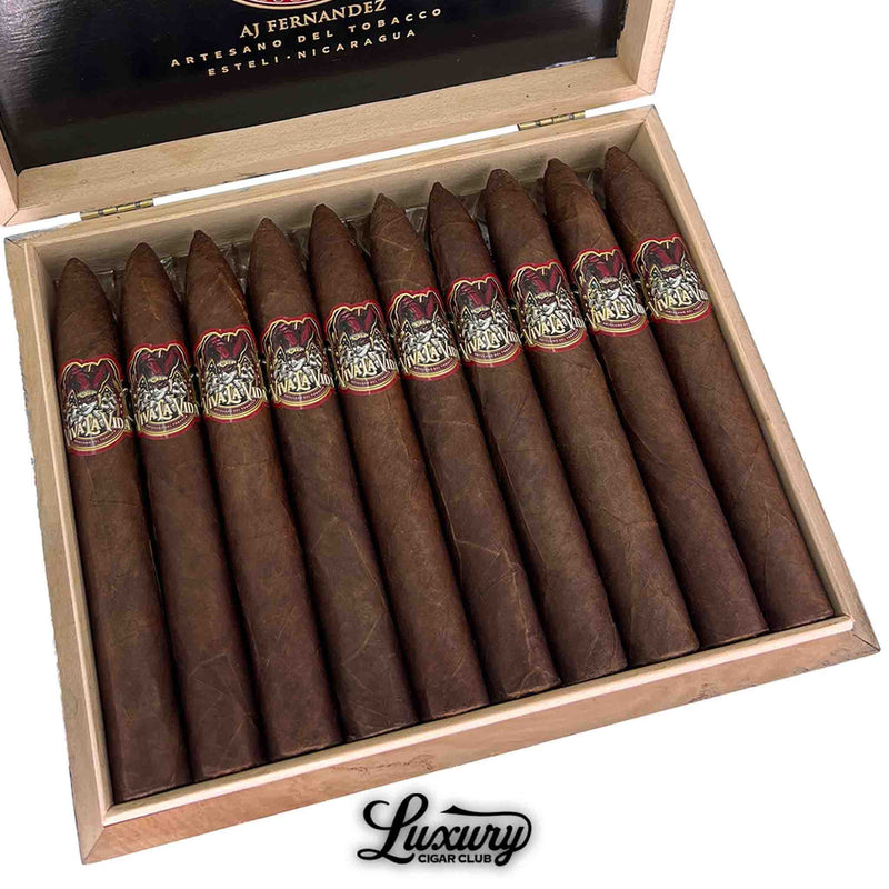 Close-up view of Viva La Vida Torpedo cigars by AJ Fernandez in an open box, highlighting the pointed heads and detailed band artwork.