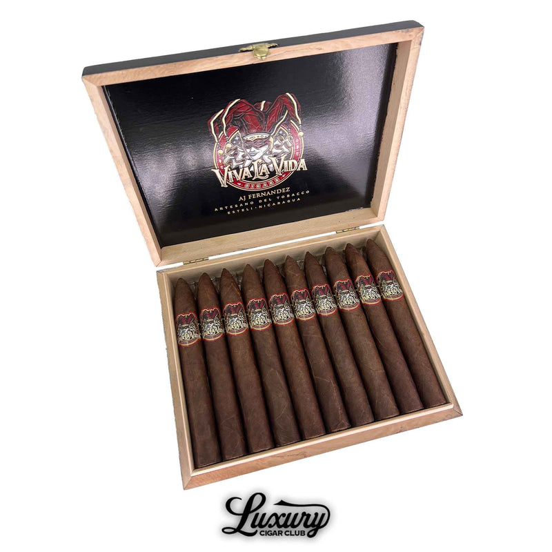 Open box of Viva La Vida Torpedo cigars by AJ Fernandez, showcasing pointed heads and bold band artwork against a dark interior lid.
