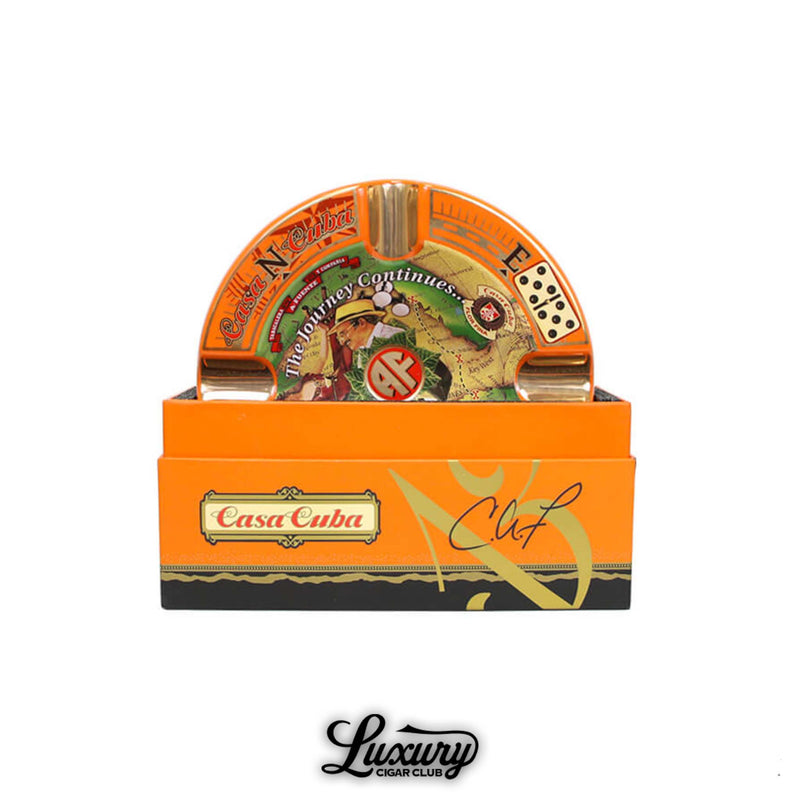 Arturo Fuente Casa Cuba limited edition porcelain ashtray displayed in original orange and black packaging with compass-themed design, domino illustrations, and AF logo.