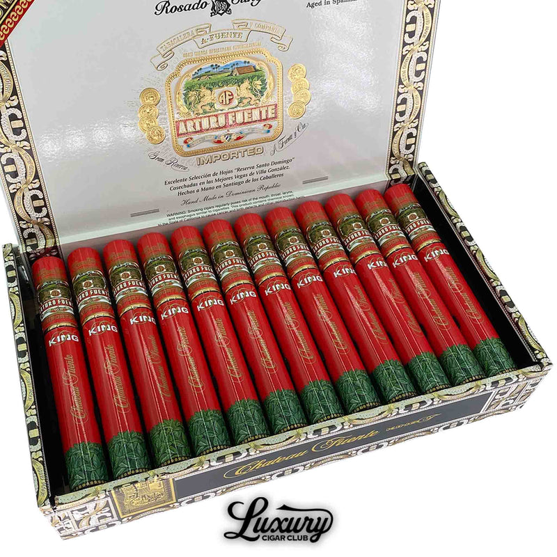 Close-up view of Arturo Fuente Chateau Fuente King T Rosado Sun Grown Tubo cigars in a decorative box, featuring red and green aluminum tubes with branded bands.