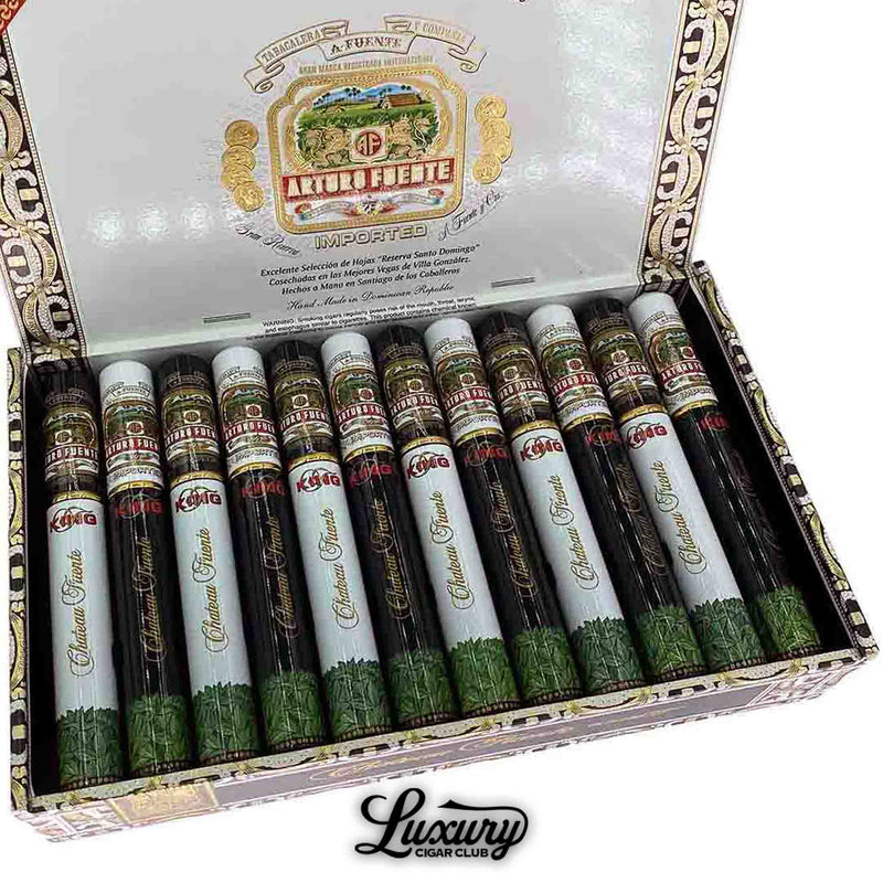 Close-up of Arturo Fuente Chateau Fuente King T Tubo cigars in decorative tubos with gold, red, and green accents, displayed in an open box at Luxury Cigar Club.