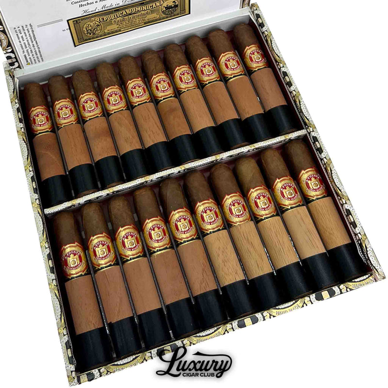 Close-up of Arturo Fuente Chateau Fuente Sun Grown cigars with cedar wraps at Luxury Cigar Club.