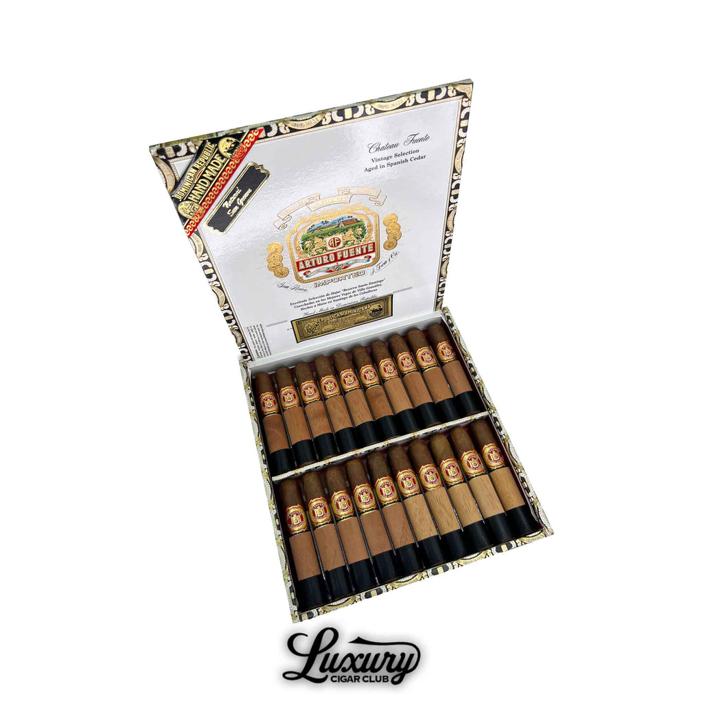 Open box of Arturo Fuente Chateau Fuente Sun Grown cigars with cedar sleeves displayed at Luxury Cigar Club.