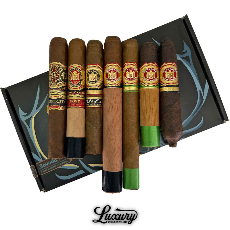 Close-up of Arturo Fuente Crown Jewels Sampler showing detailed cigar bands and cedar wraps, displayed on a Luxury Cigar Club box with Boveda humidity control.