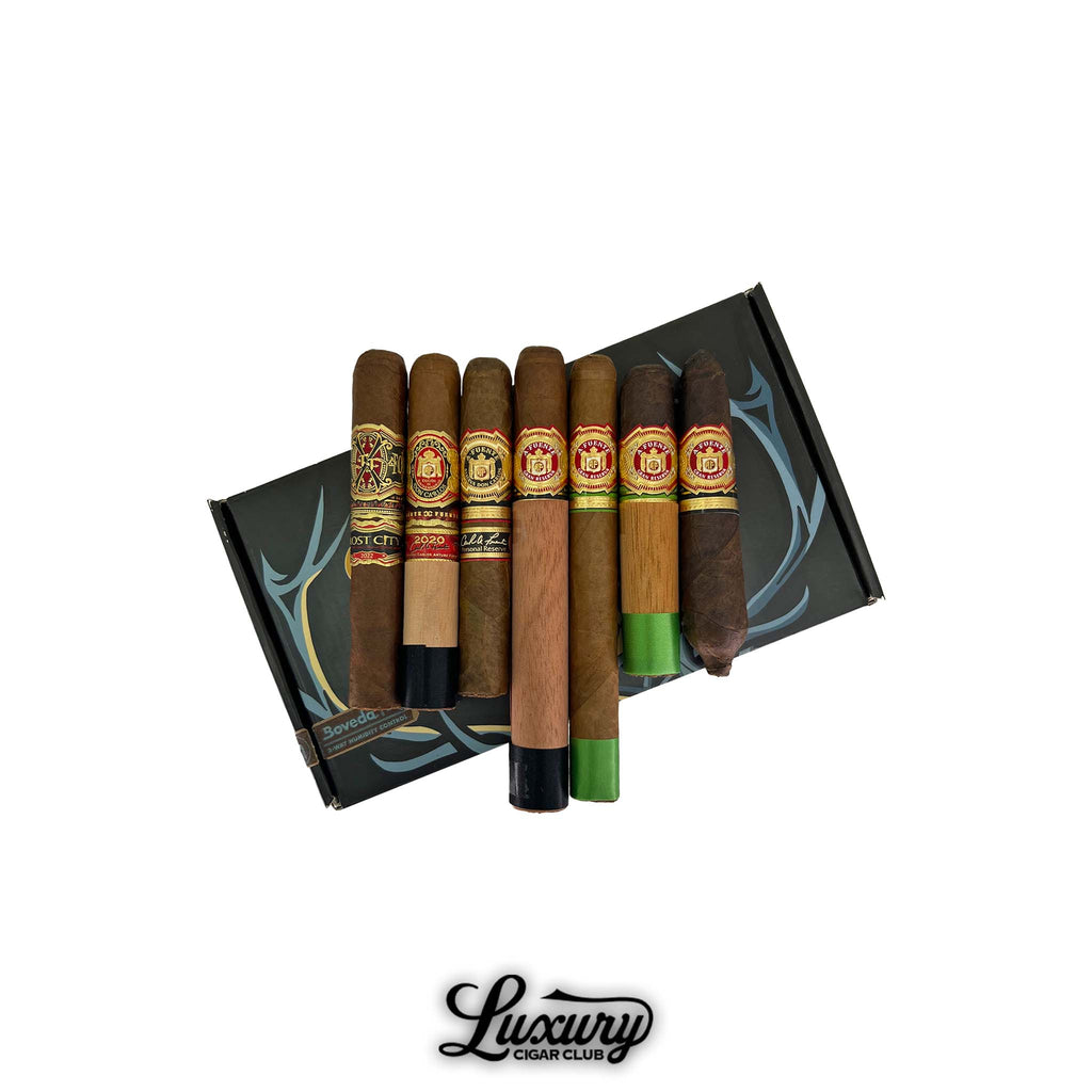 Arturo Fuente Crown Jewels Sampler featuring premium cigars arranged on a Luxury Cigar Club box, including OpusX Lost City, 2020 Rare Pink, and classic Fuente selections.