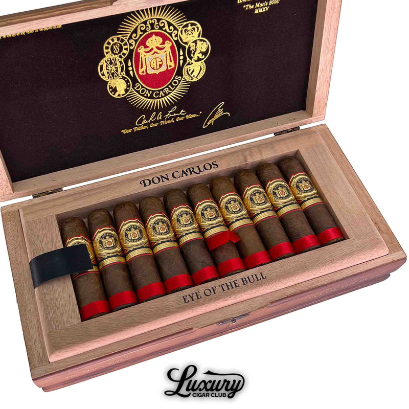 Close up view of Arturo Fuente Don Carlos Eye of the Bull cigars inside a wooden box with black and gold logo, available at Luxury Cigar Club.
