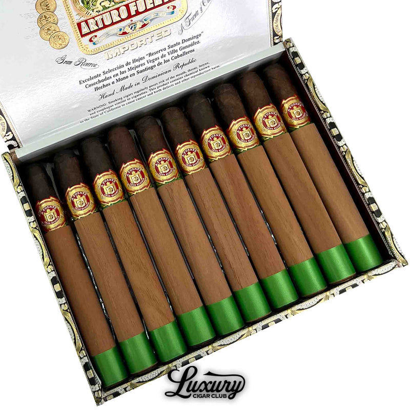 Close-up of Arturo Fuente Double Chateau Fuente Maduro cigars in original box with cedar wraps and decorative cigar bands.