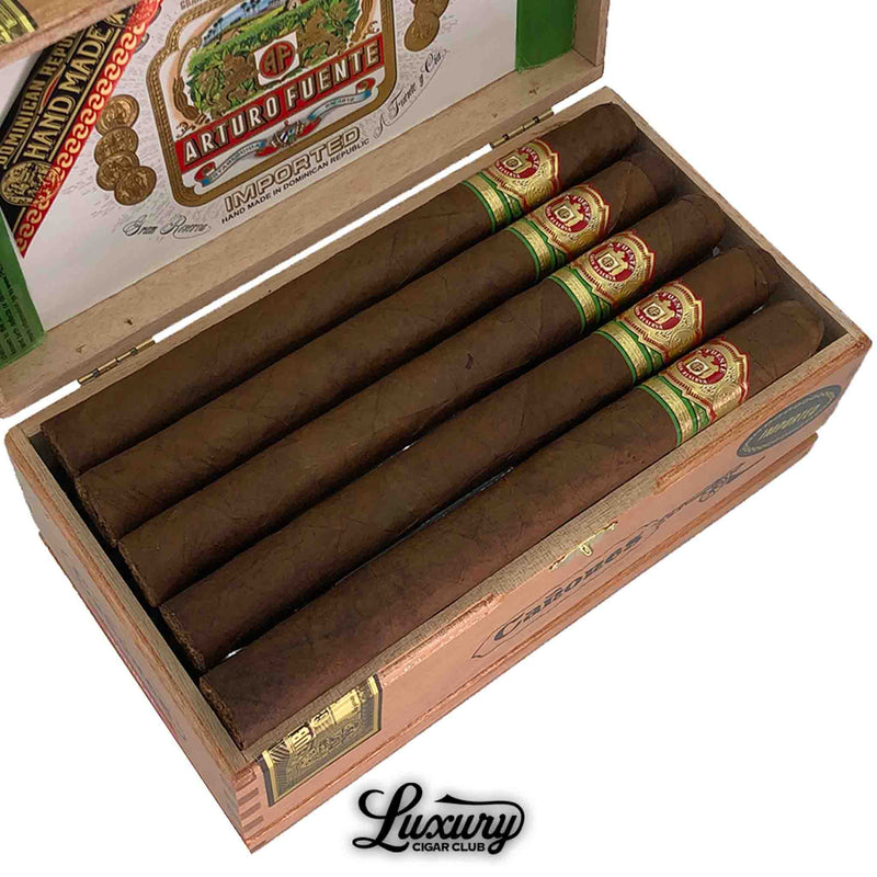 Close-up of Arturo Fuente Gran Reserva Canones Natural Presidente cigars inside an open box, highlighting the smooth wrapper and detailed band design.